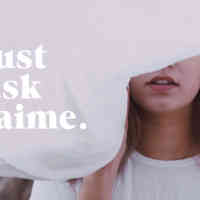 Woman under a floating sheet with the words Just Ask Jaime written out