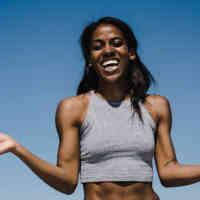 Woman laughing with hands out