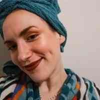 Woman wearing towel turban and bathrobe