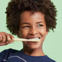 Cute kids brushing teeth with Schmidt's Kids Toothpaste in Watermelon+Strawberry