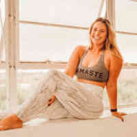 woman in yoga clothes sitting