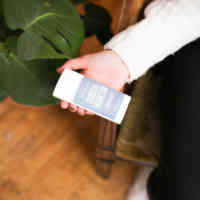 woman holding schmidt's charcoal and magnesium deodorant