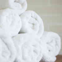 stack of rolled white towels